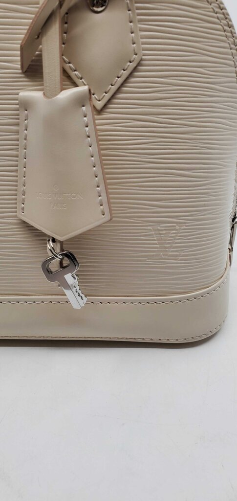 Louis Vuitton Alma BB in Quartz White Epi Leather and jacquard Strap