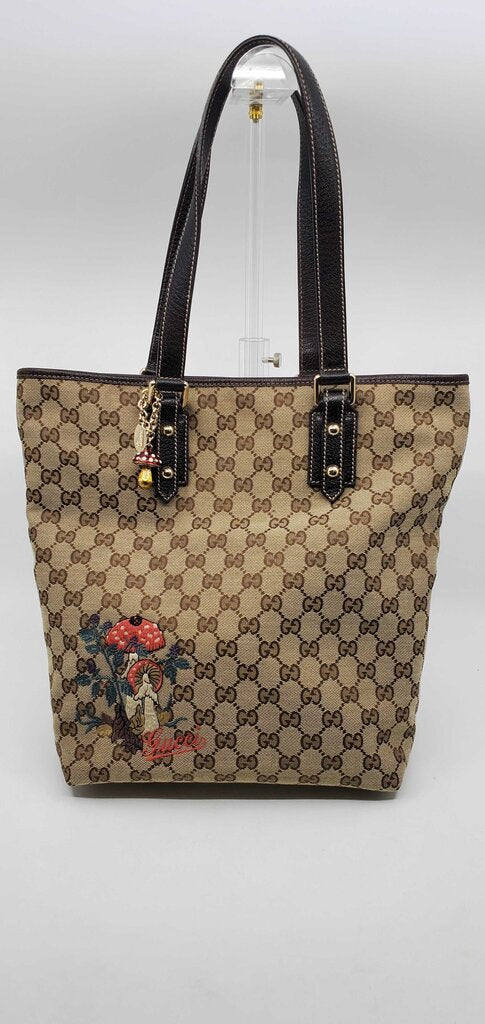 Gucci Beige/Brown GG Canvas tote bag featuring mushroom embroidery and a mushroom charm