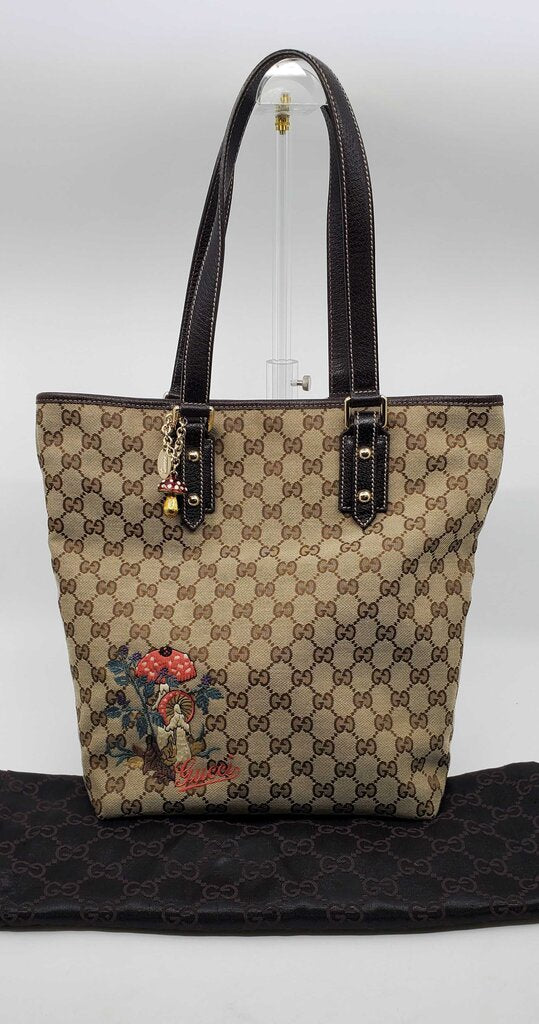 Gucci Beige/Brown GG Canvas tote bag featuring mushroom embroidery and a mushroom charm