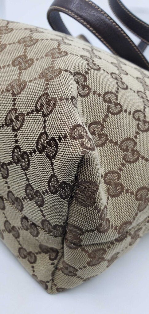 Gucci Beige/Brown GG Canvas tote bag featuring mushroom embroidery and a mushroom charm