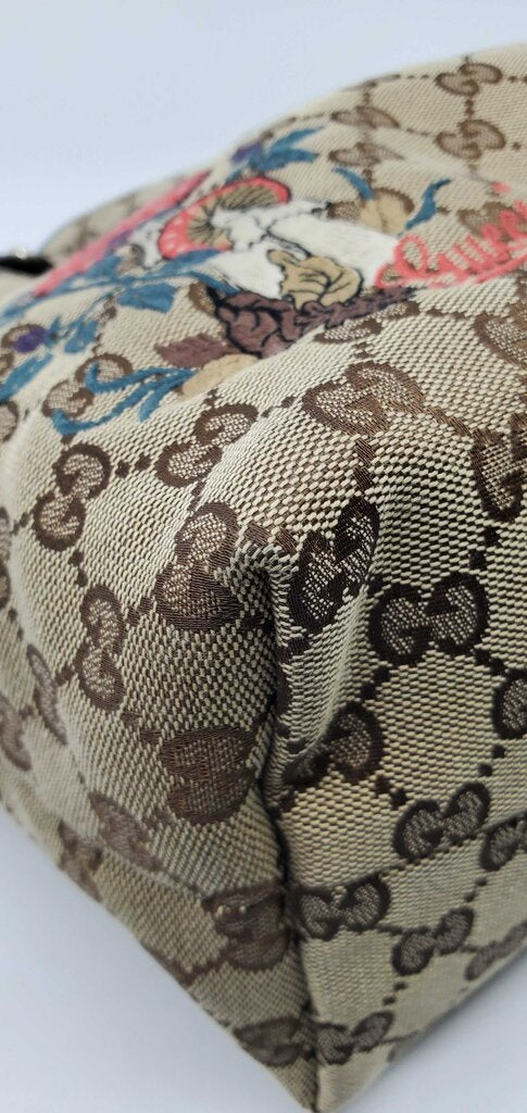 Gucci Beige/Brown GG Canvas tote bag featuring mushroom embroidery and a mushroom charm