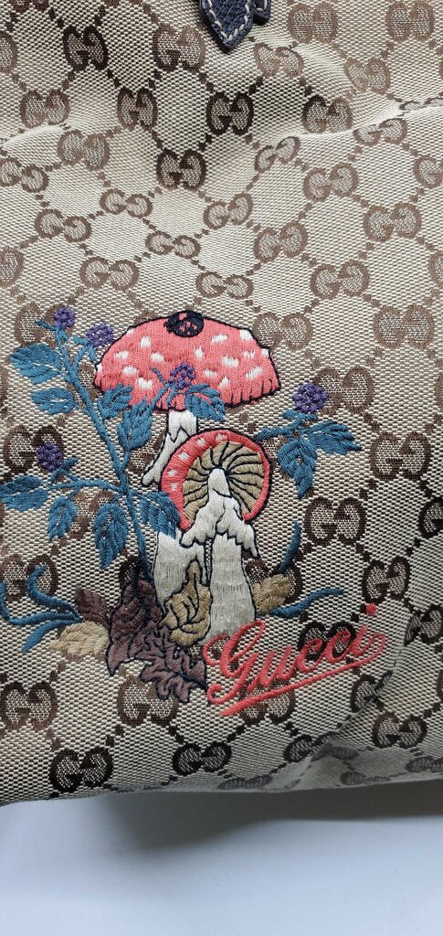 Gucci Beige/Brown GG Canvas tote bag featuring mushroom embroidery and a mushroom charm